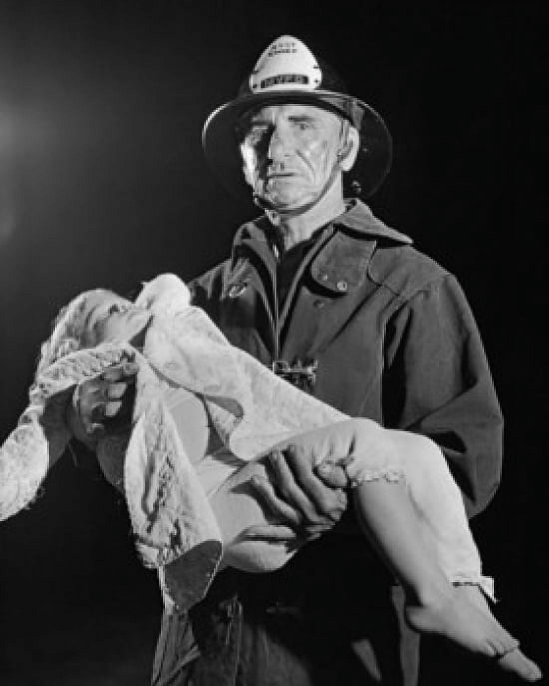 Portrait of a fireman carrying an injured child Canvas Art - (24 x 36)