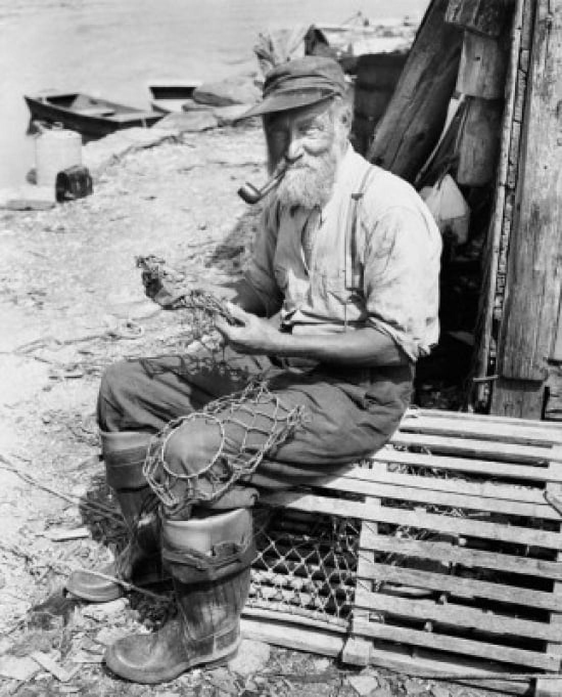 Portrait of a fisherman sitting on a lobster trap and holding a fishing net Canvas Art - (24 x 36)
