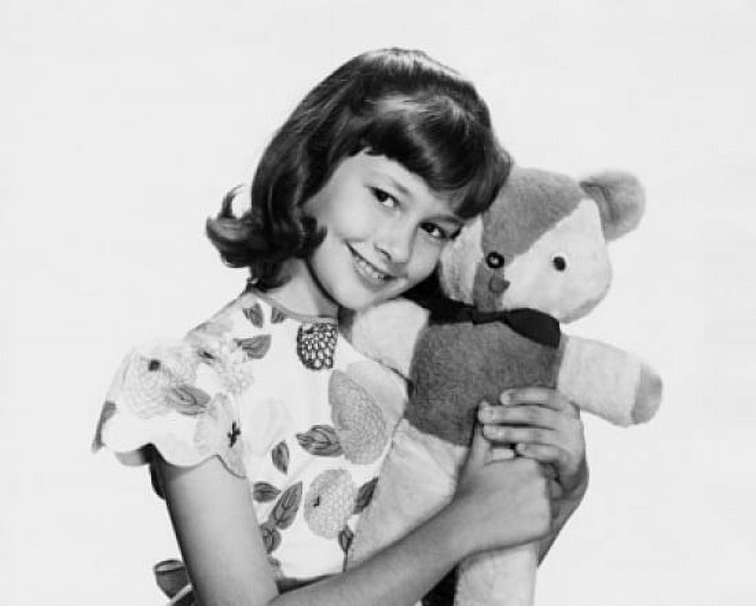 Portrait of a girl holding a teddy bear and smiling Canvas Art - (18 x 24)