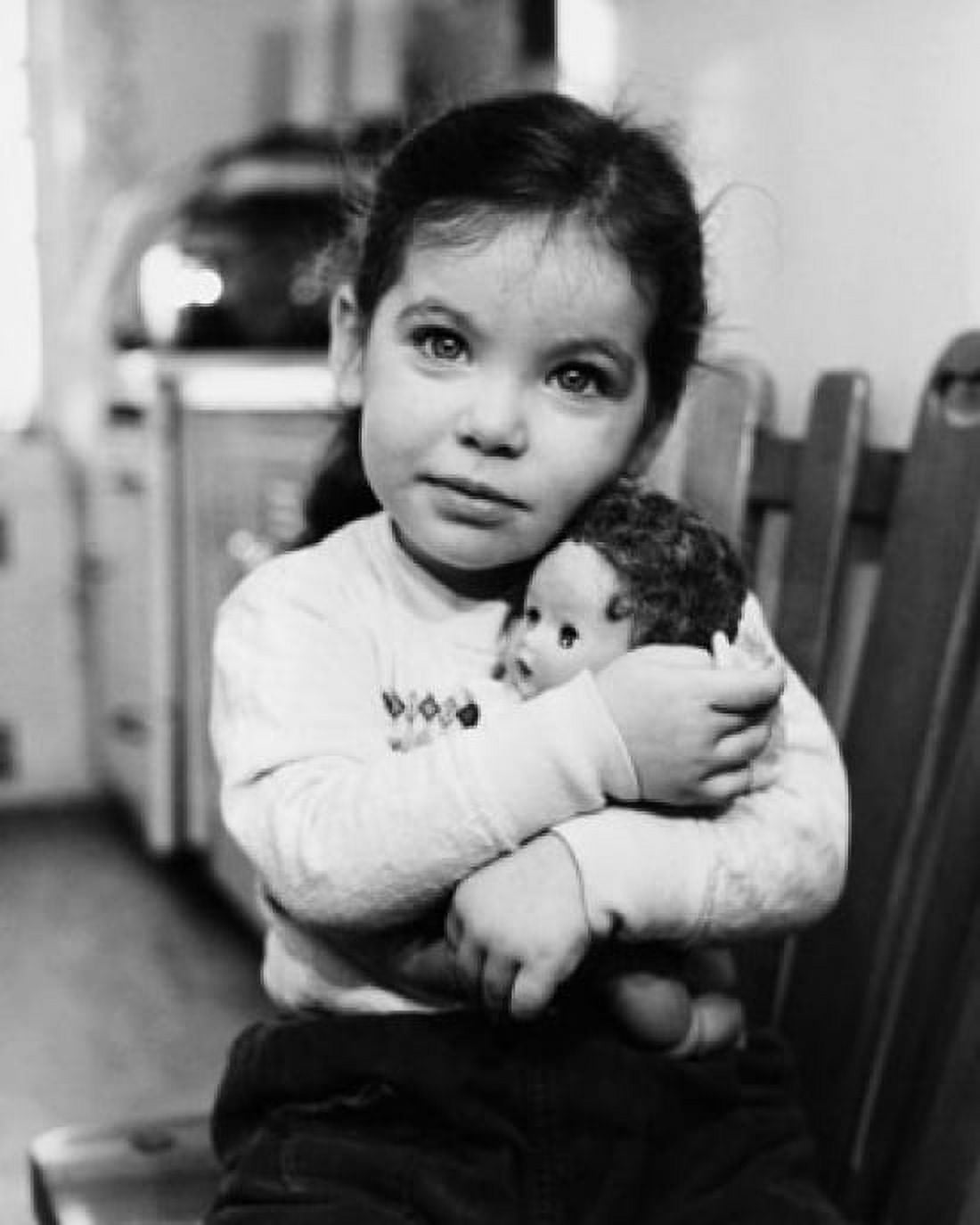 Portrait of a girl hugging a doll Canvas Art - (18 x 24)
