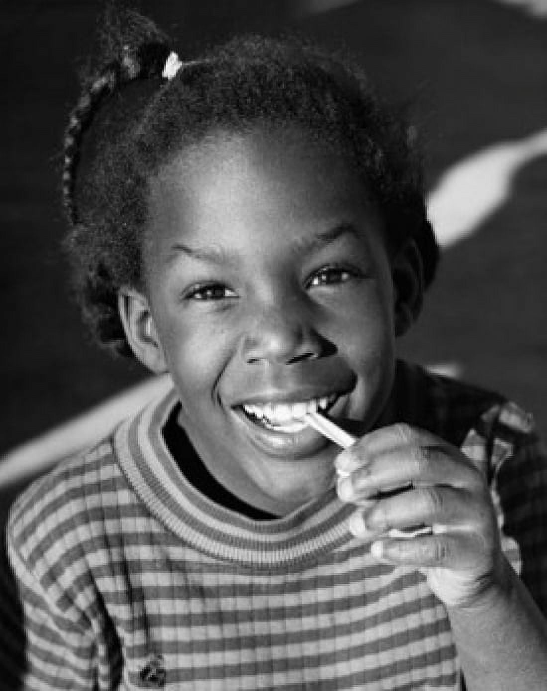 Portrait of a girl pulling bubble gum from her mouth Canvas Art - (18 x 24)