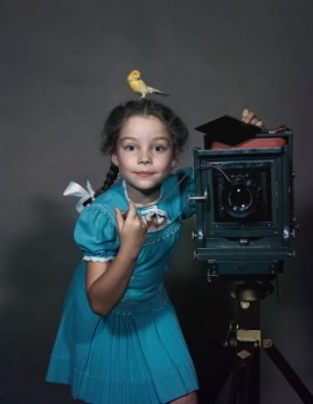 Portrait of a girl standing near a camera with a canary on her head Canvas Art - (18 x 24)