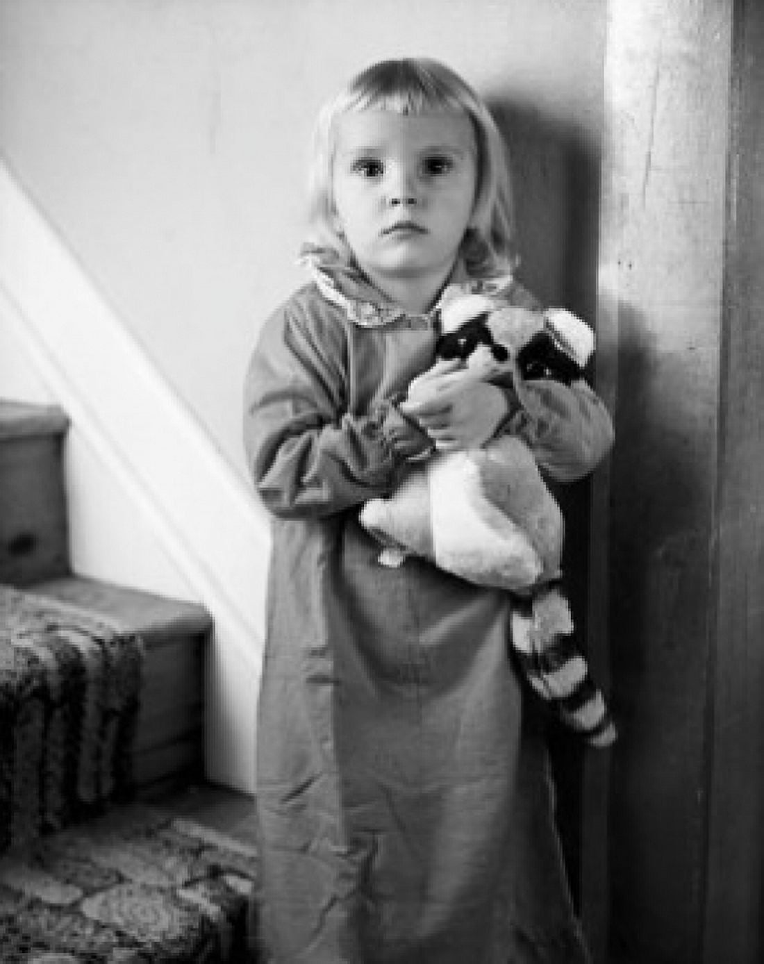 Portrait of a girl standing on a staircase with her stuffed toy Canvas Art - (18 x 24)