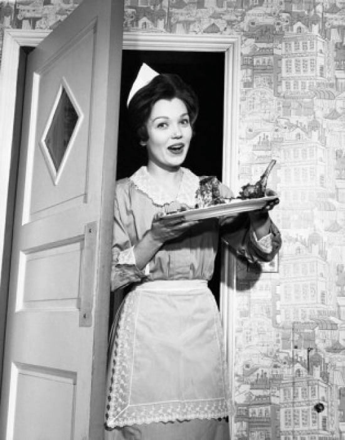 Portrait of a maid standing in a doorway and holding a plate of food Canvas Art - (18 x 24)