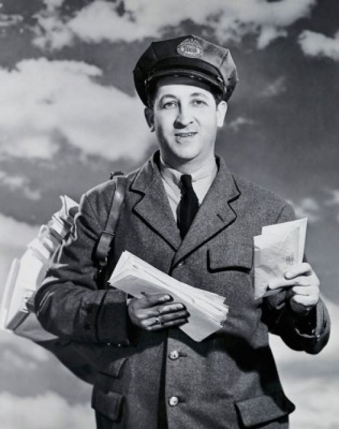 Portrait of a mailman holding letters and smiling Canvas Art - (18 x 24)