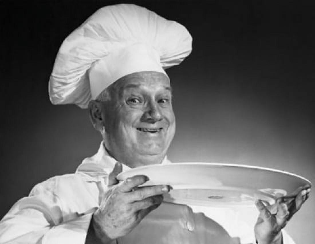 Portrait of a male chef holding a plate and smiling Canvas Art - (24 x 36)