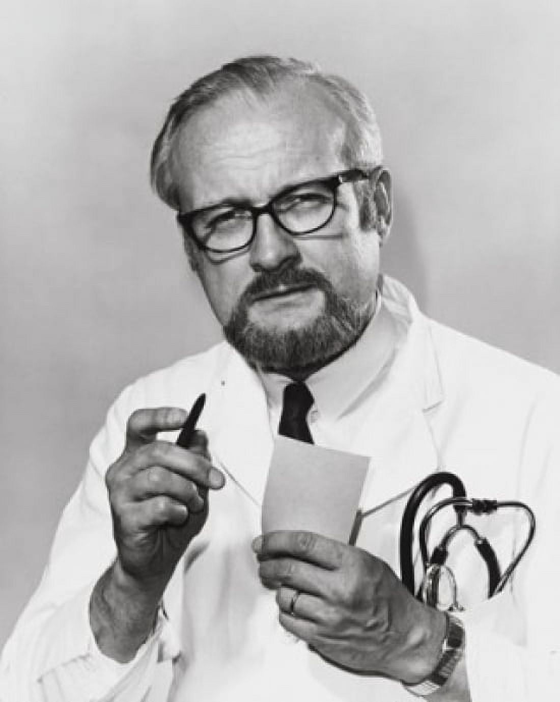 Portrait of a male doctor holding a pen and a paper Canvas Art - (24 x 36)