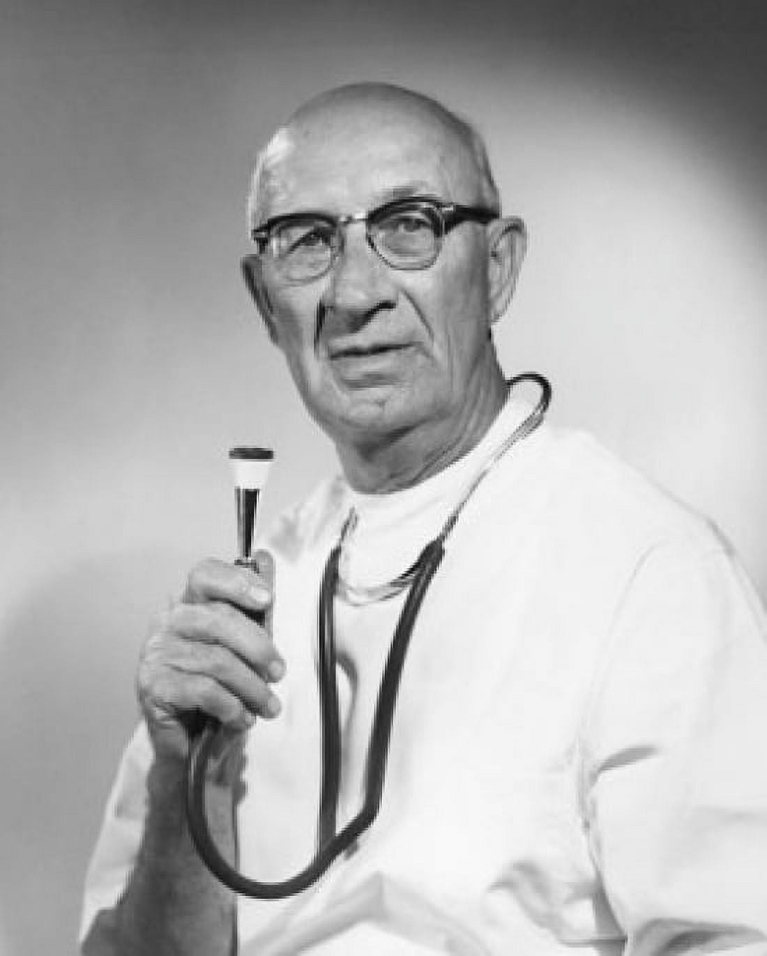 Portrait of a male doctor holding a stethoscope Canvas Art - (18 x 24)