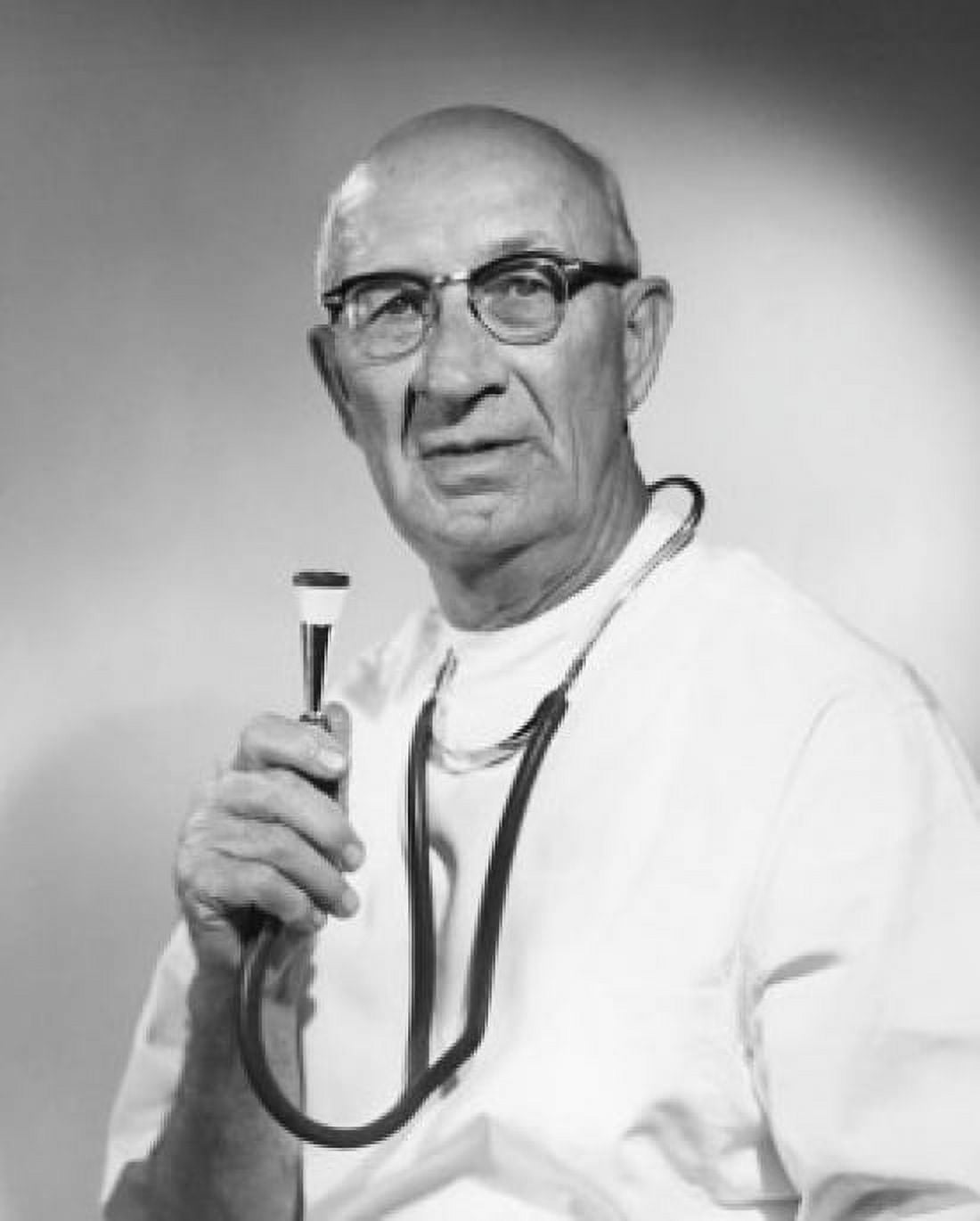 Portrait of a male doctor holding a stethoscope Canvas Art - (24 x 36)