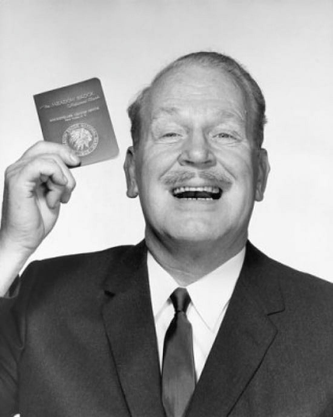 Portrait of a mature man holding a bankbook and laughing Canvas Art - (24 x 36)