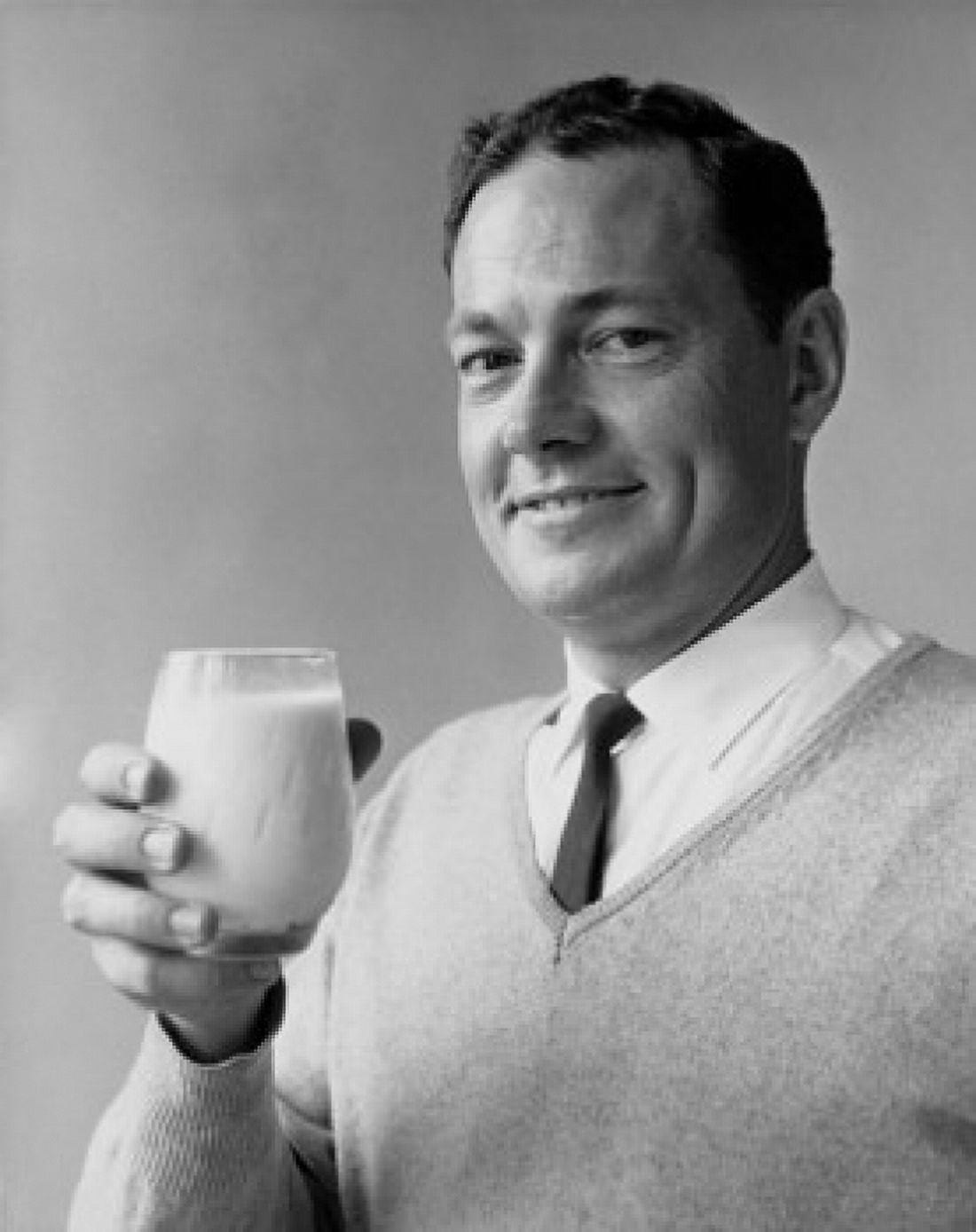 Portrait of a mature man holding a glass of milk Canvas Art - (18 x 24)