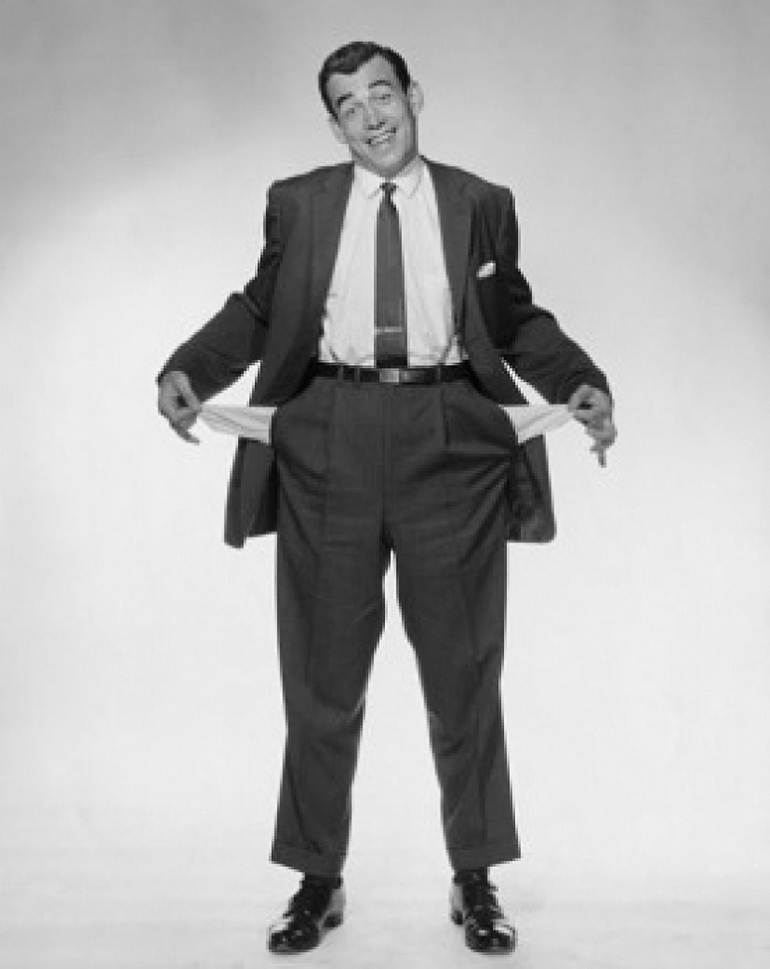 Portrait of a mature man showing off his empty pockets and smiling Canvas Art - (24 x 36)