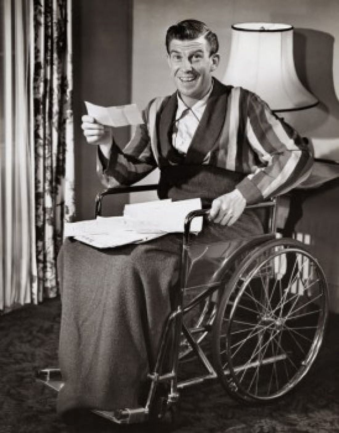 Portrait of a mature man sitting on a wheel chair smiling about a check Canvas Art - (18 x 24)