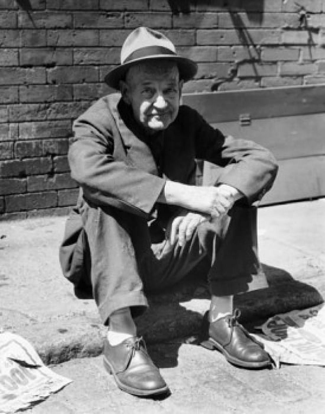 Portrait of a mature man sitting on the street Canvas Art - (18 x 24)