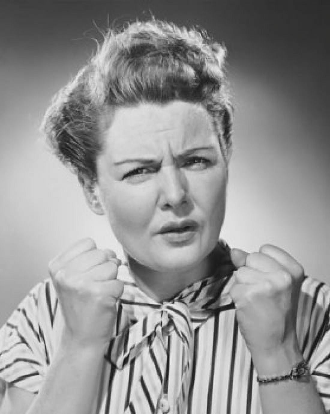 Portrait of a mature woman clenching her fists in anger Canvas Art - (24 x 36)