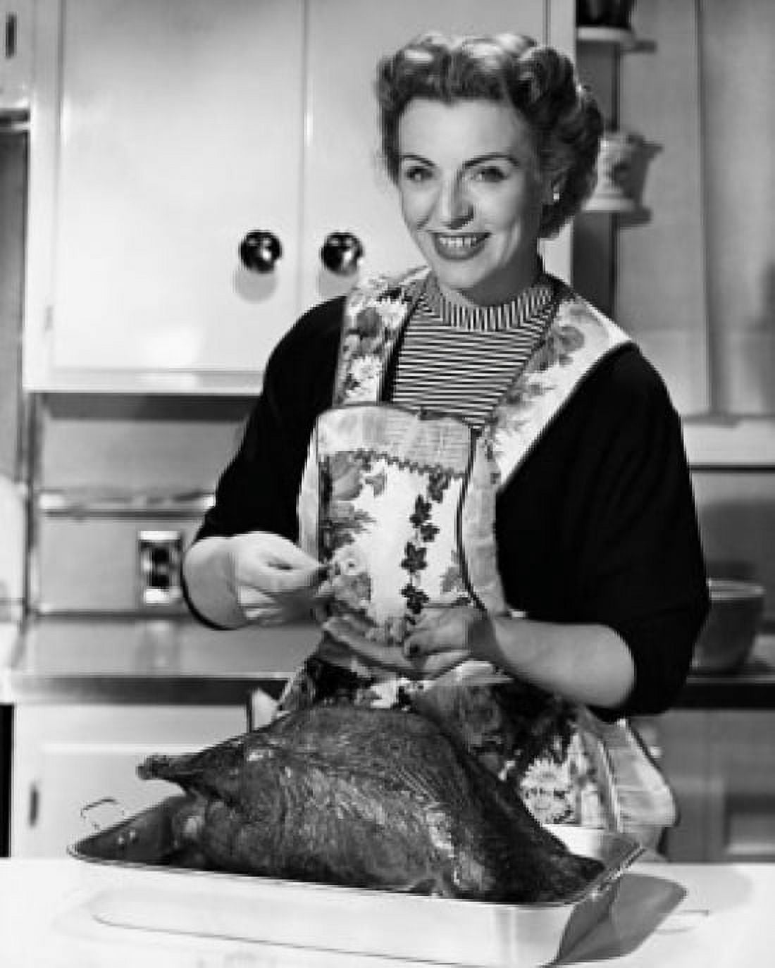 Portrait of a mature woman preparing a turkey in the kitchen Canvas Art - (18 x 24)