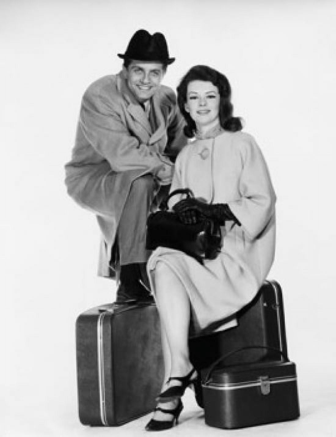 Portrait of a mid adult couple sitting with luggage Canvas Art - (24 x 36)