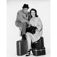 thumbnail image 1 of Portrait of a mid adult couple sitting with luggage Poster Print (18 x 24), 1 of 4