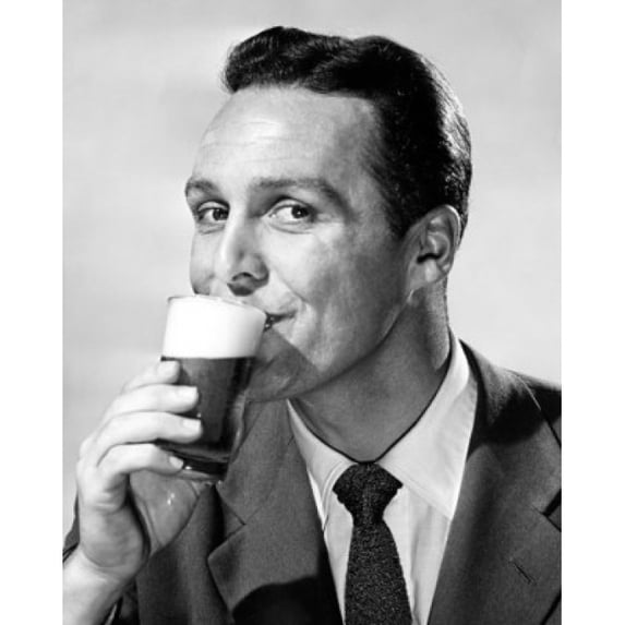 Portrait of a mid adult man drinking beer Poster Print (24 x 36)