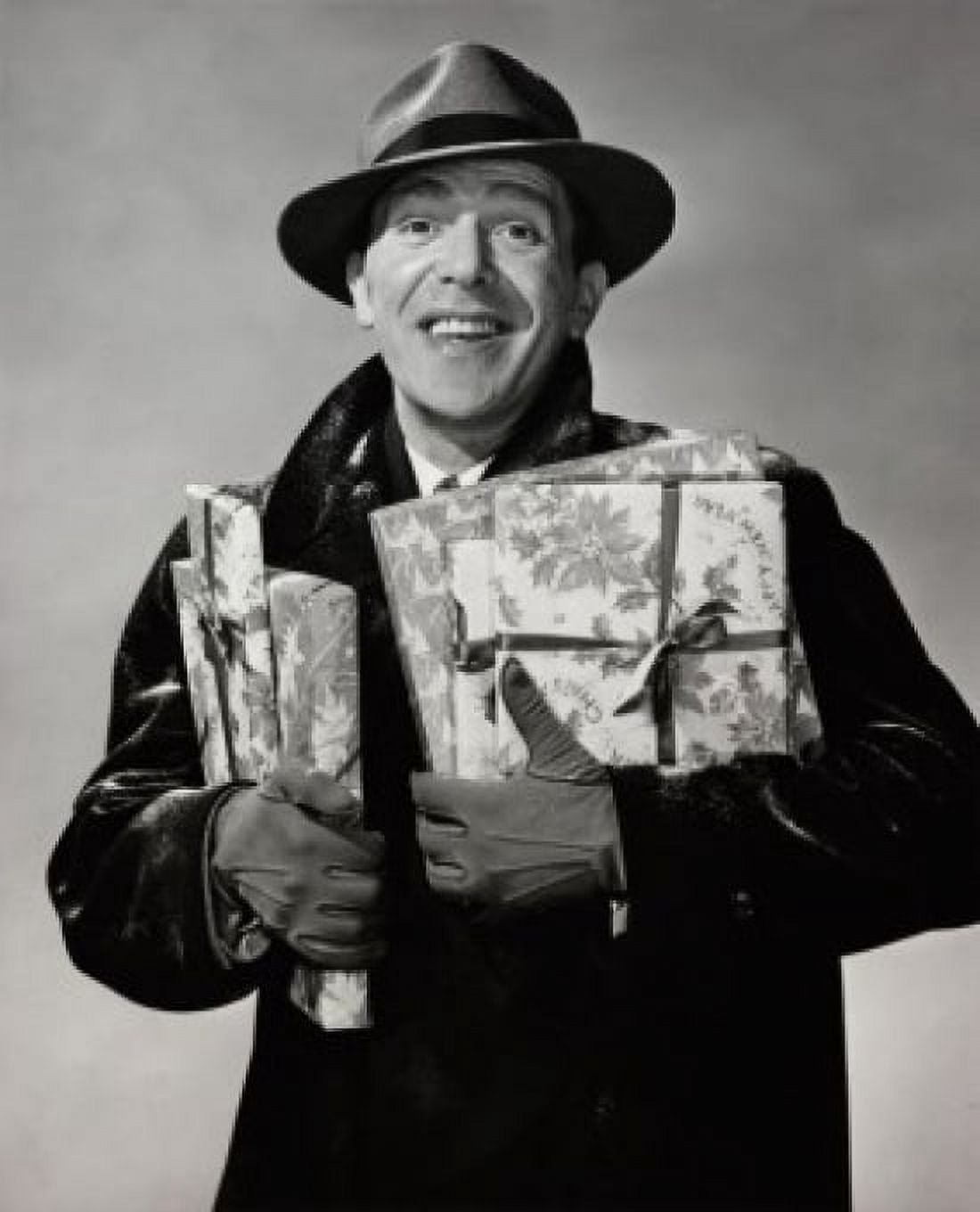 Portrait of a mid adult man holding Christmas presents and smiling Canvas Art - (18 x 24)