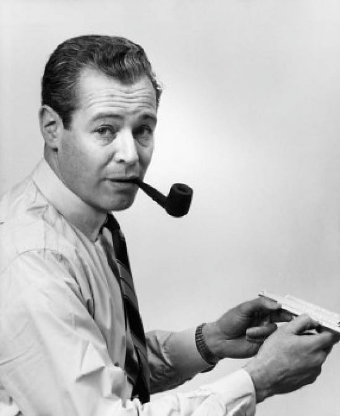 Portrait of a mid adult man smoking a pipe and holding a slide rule Canvas Art - (18 x 24)