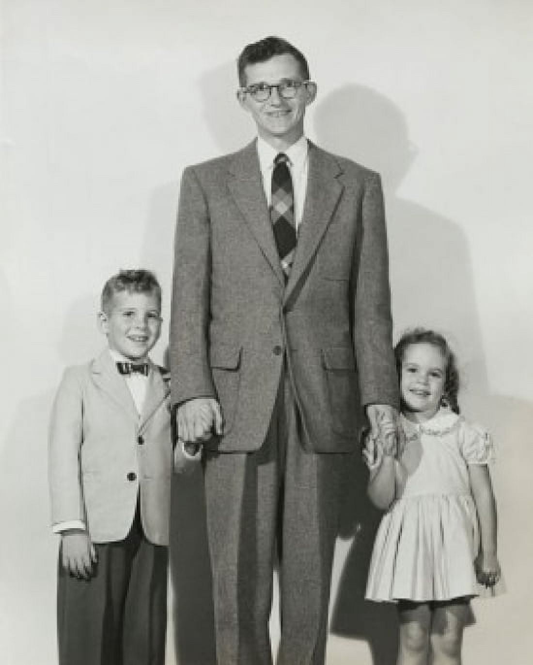 Portrait of a mid adult man standing with his son and daughter Canvas Art - (24 x 36)