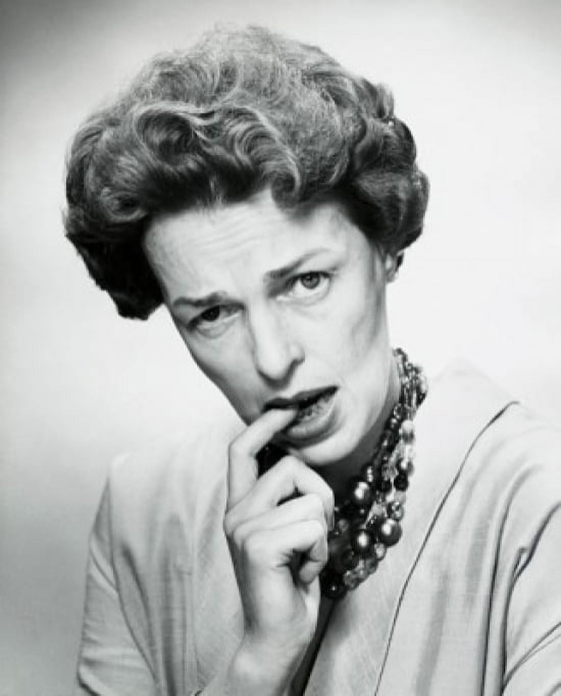 Portrait of a mid adult woman biting her finger Canvas Art - (24 x 36)