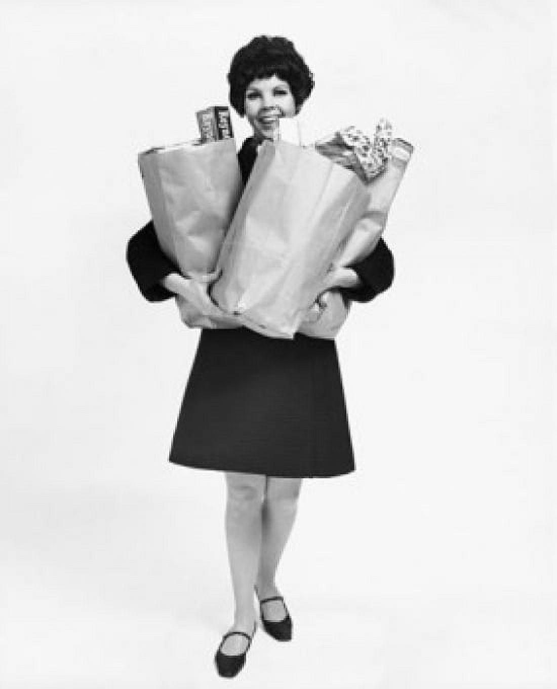 Portrait of a mid adult woman carrying groceries Canvas Art - (18 x 24)