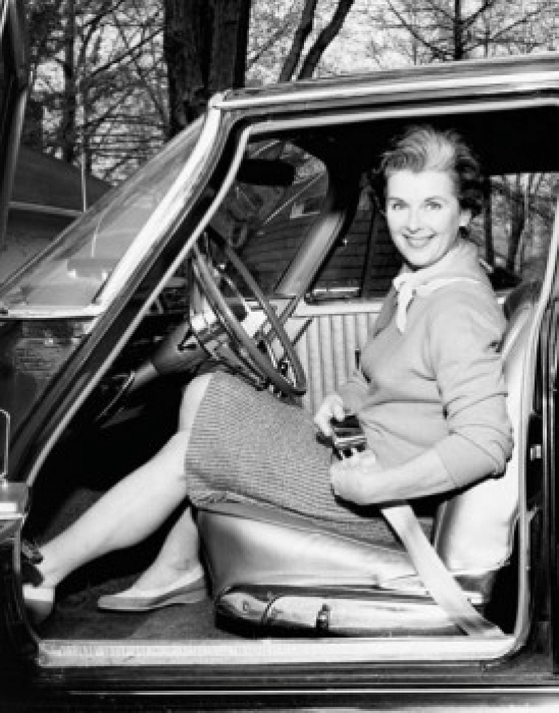 Portrait of a mid adult woman her strapping seat belt in a car Canvas Art - (18 x 24)