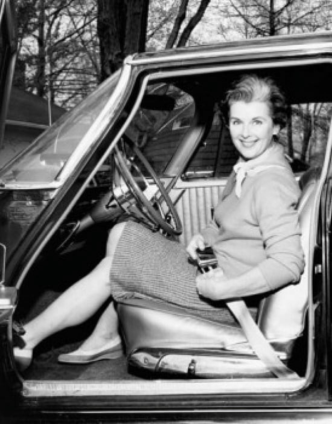 Portrait of a mid adult woman her strapping seat belt in a car Canvas Art - (24 x 36)