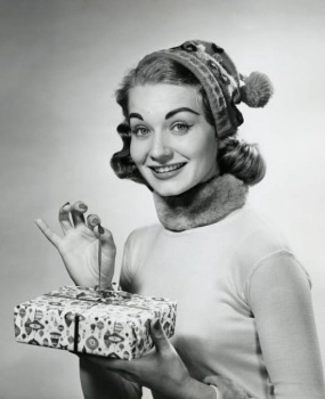 Portrait of a mid adult woman holding a Christmas present Canvas Art - (18 x 24)