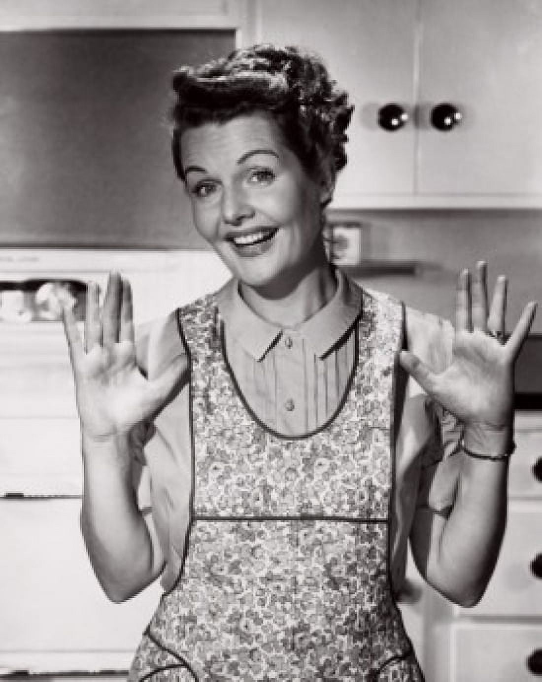 Portrait of a mid adult woman in an apron smiling Canvas Art - (24 x 36)
