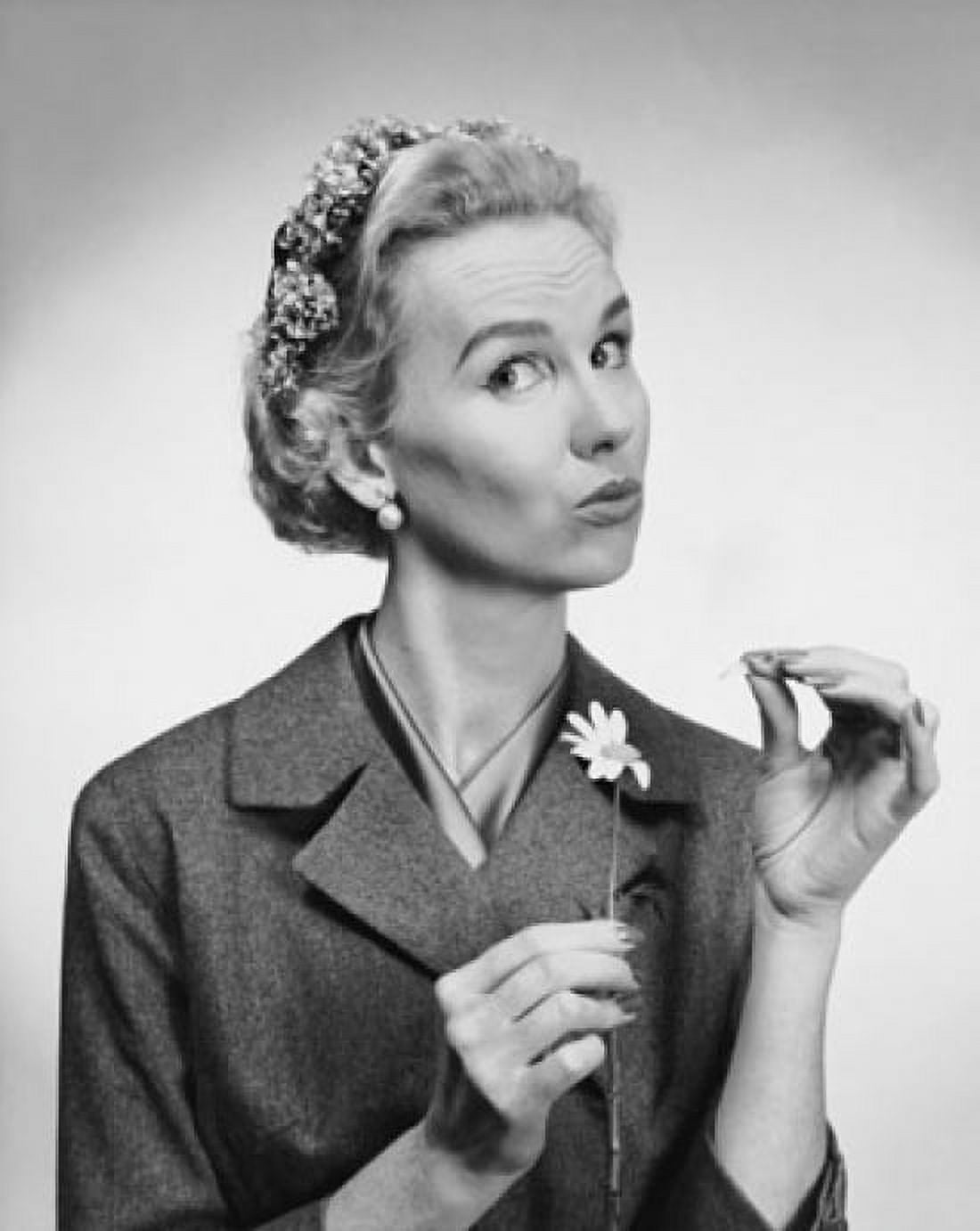 Portrait of a mid adult woman picking petals from a flower Canvas Art - (24 x 36)