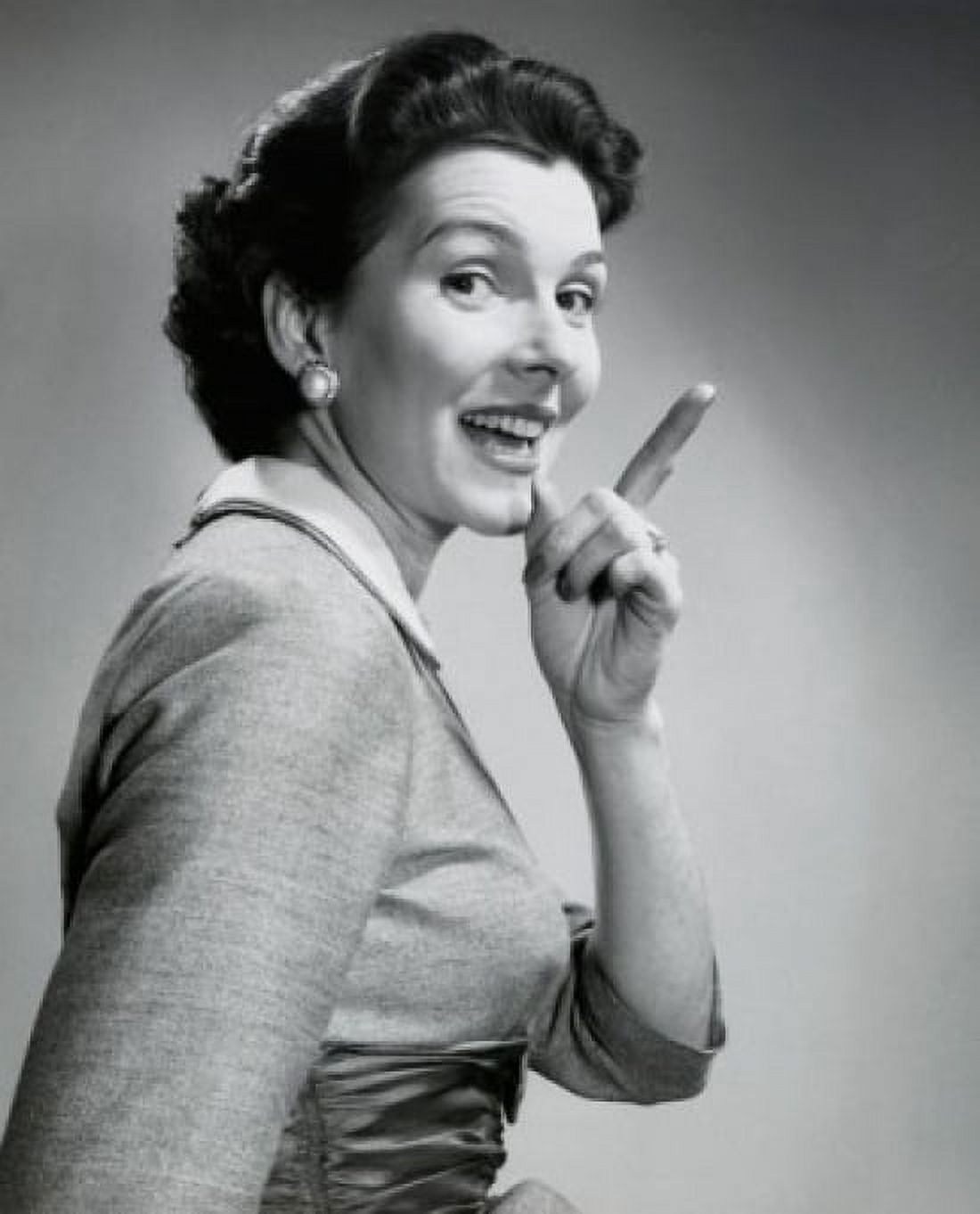 Portrait of a mid adult woman pointing with her finger and smiling Canvas Art - (24 x 36)