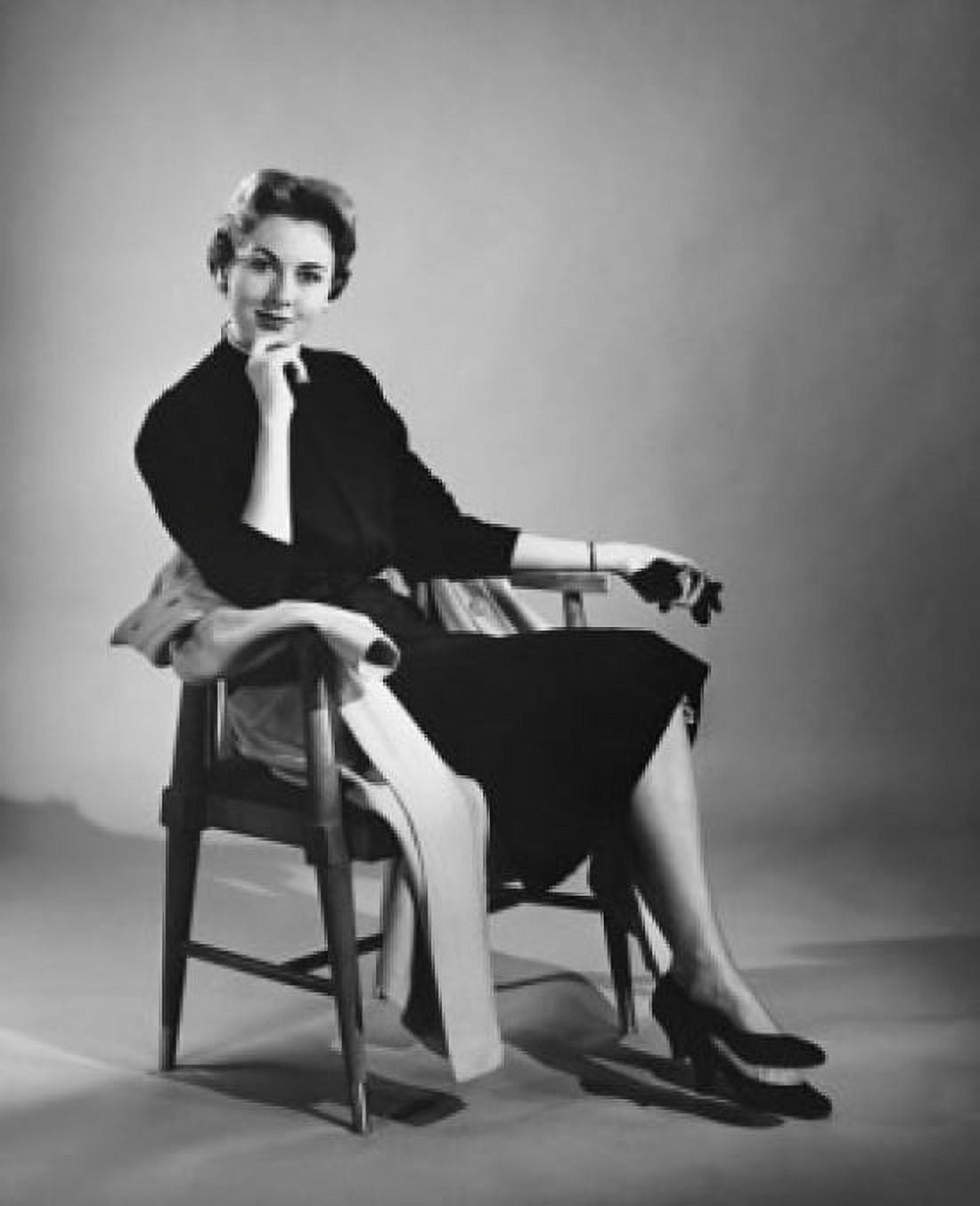 Portrait of a mid adult woman sitting in an armchair Canvas Art - (18 x 24)