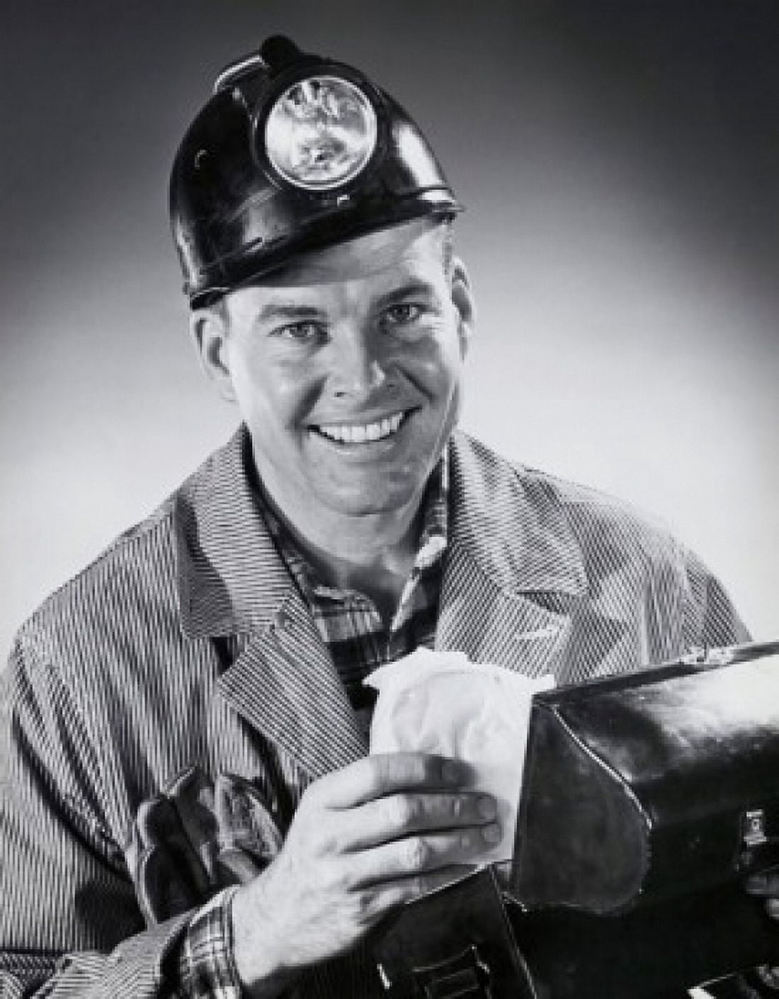 Portrait of a miner holding a lunch box and smiling Canvas Art - (24 x 36)