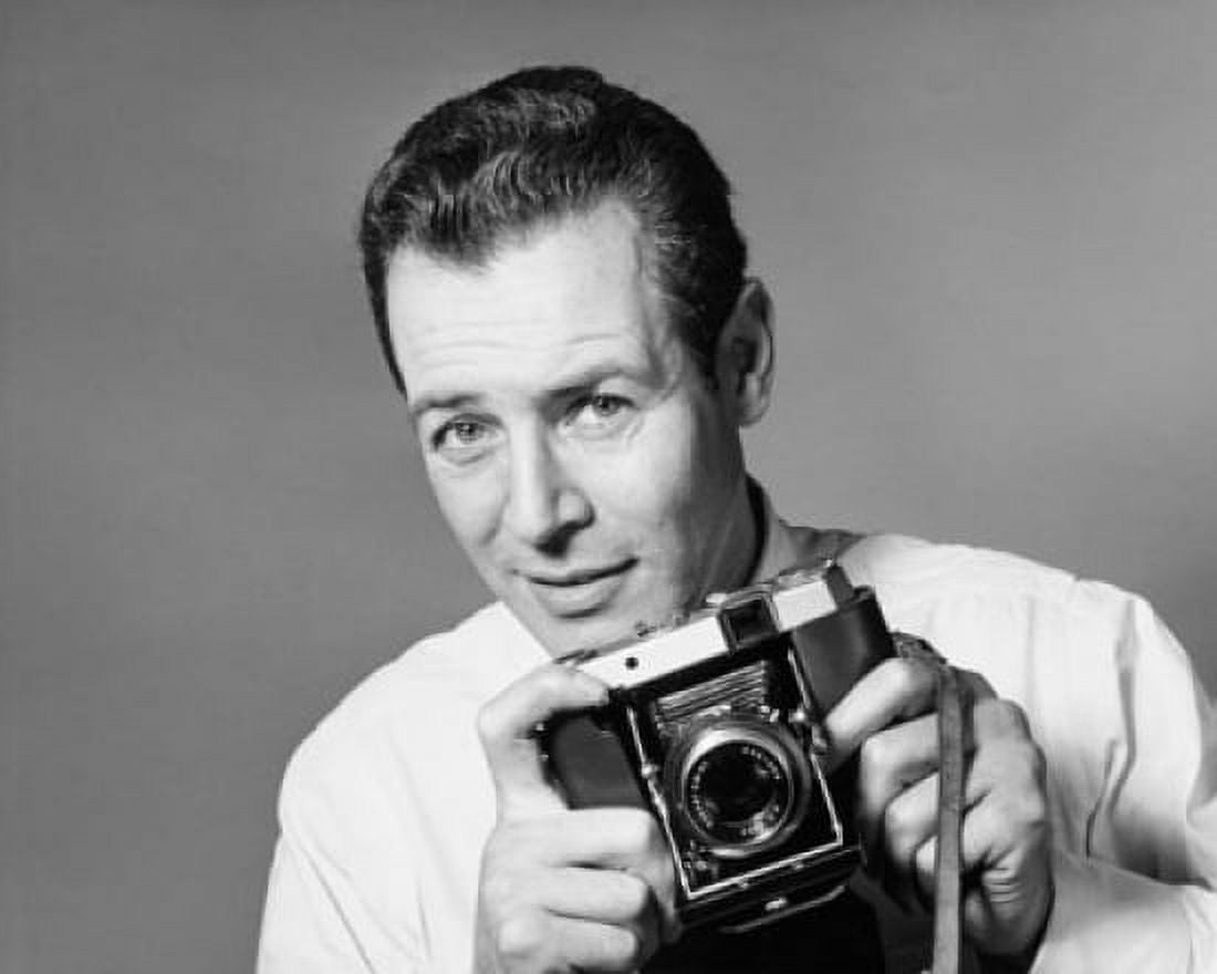 Portrait of a photographer holding a camera Canvas Art - (18 x 24)