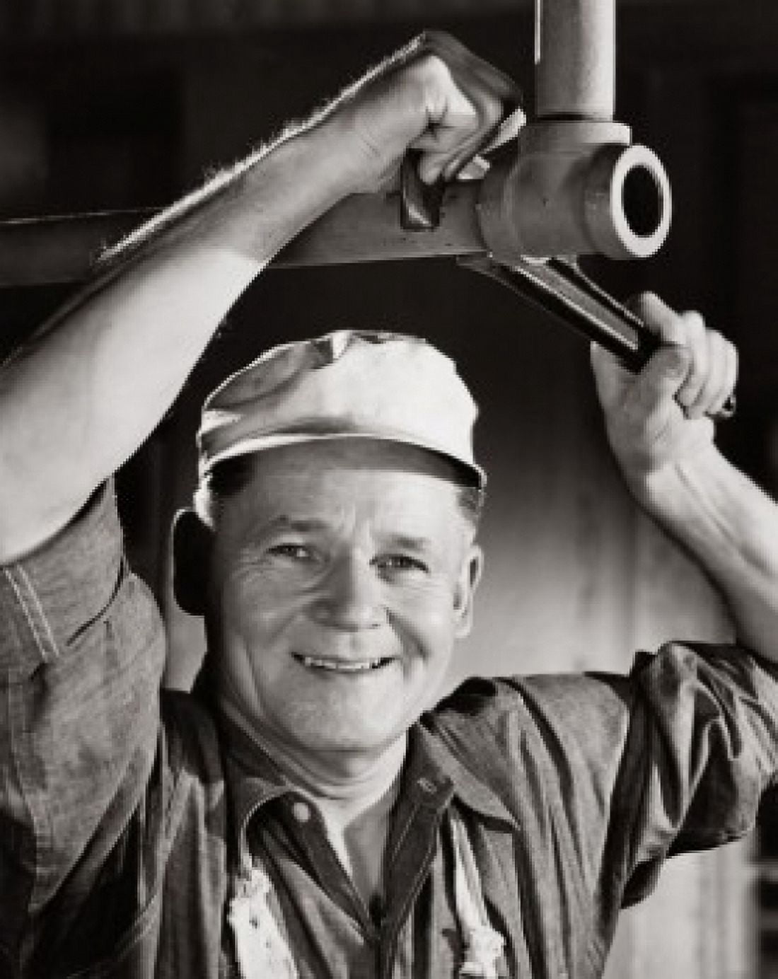Portrait of a plumber repairing pipeline using an adjustable wrench Canvas Art -  (18 x 24)