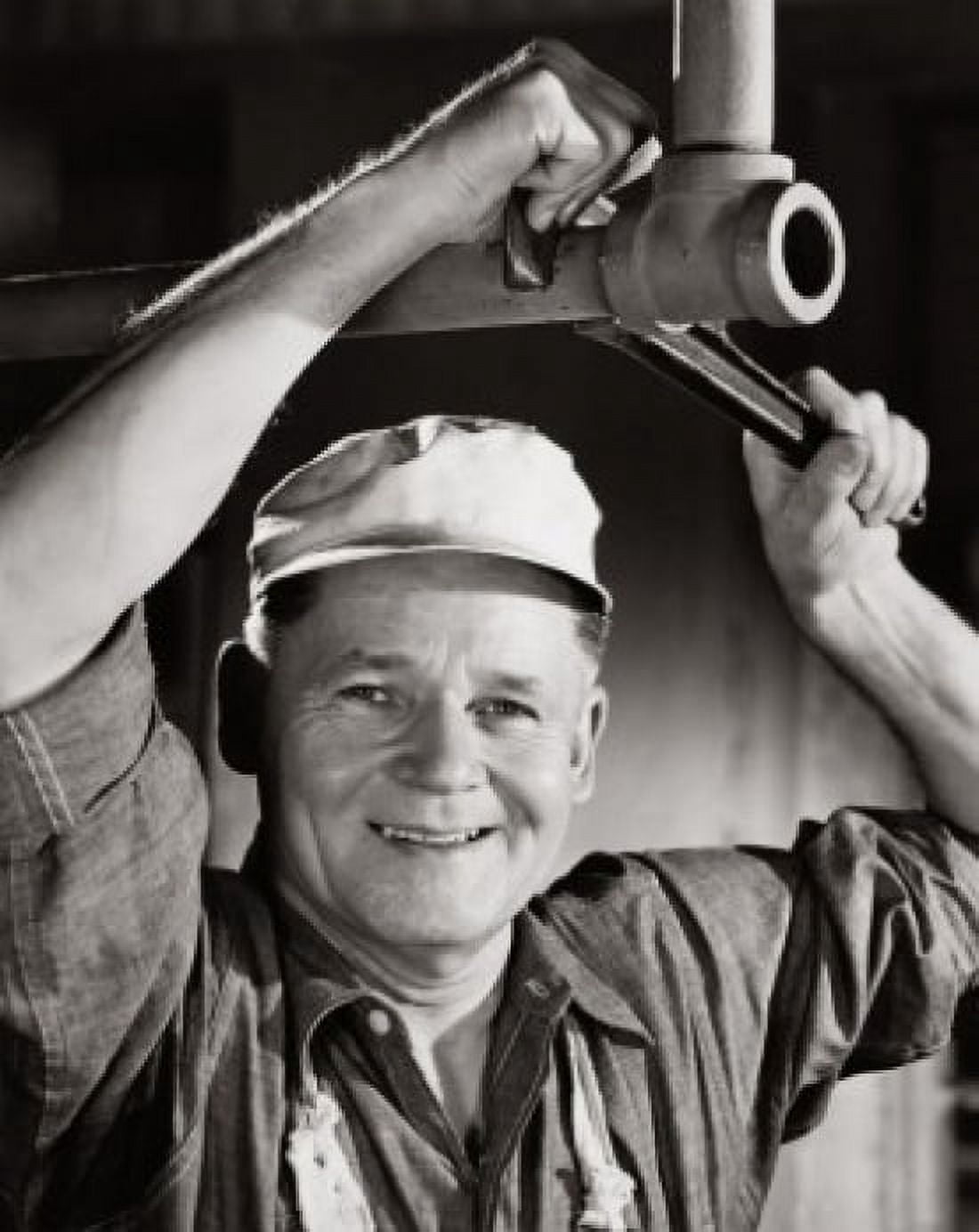 Portrait of a plumber repairing pipeline using an adjustable wrench Canvas Art - (24 x 36)