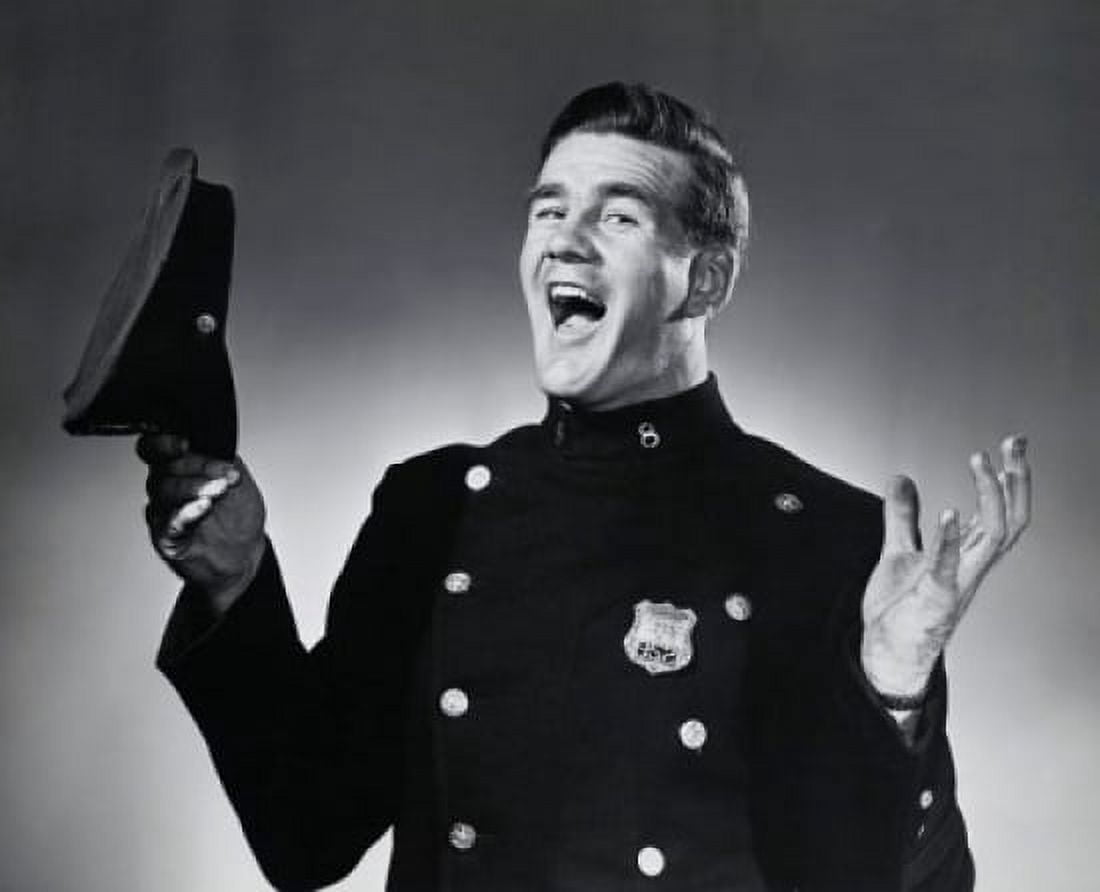Portrait of a police officer holding a uniform cap and laughing Canvas Art - (18 x 24)