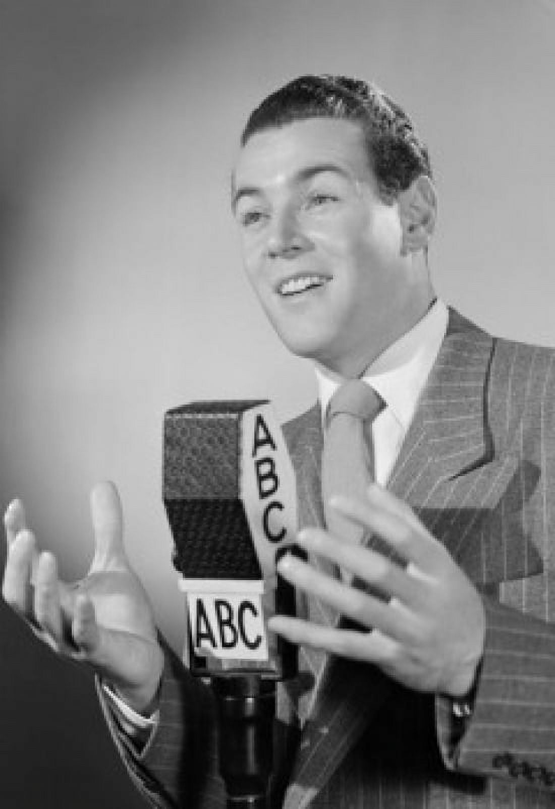 Portrait of a reporter speaking into a microphone Canvas Art - (24 x 36)