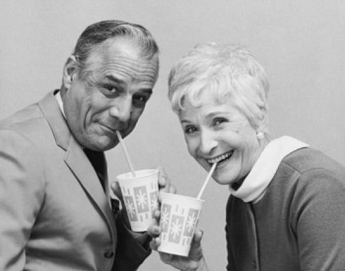 Portrait of a senior couple drinking from disposable cups Canvas Art - (18 x 24)