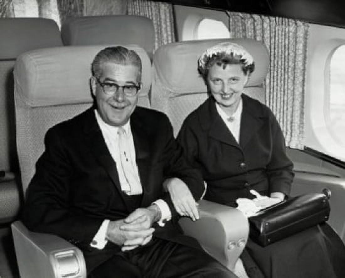 Portrait of a senior couple sitting in an airplane Canvas Art - (18 x 24)