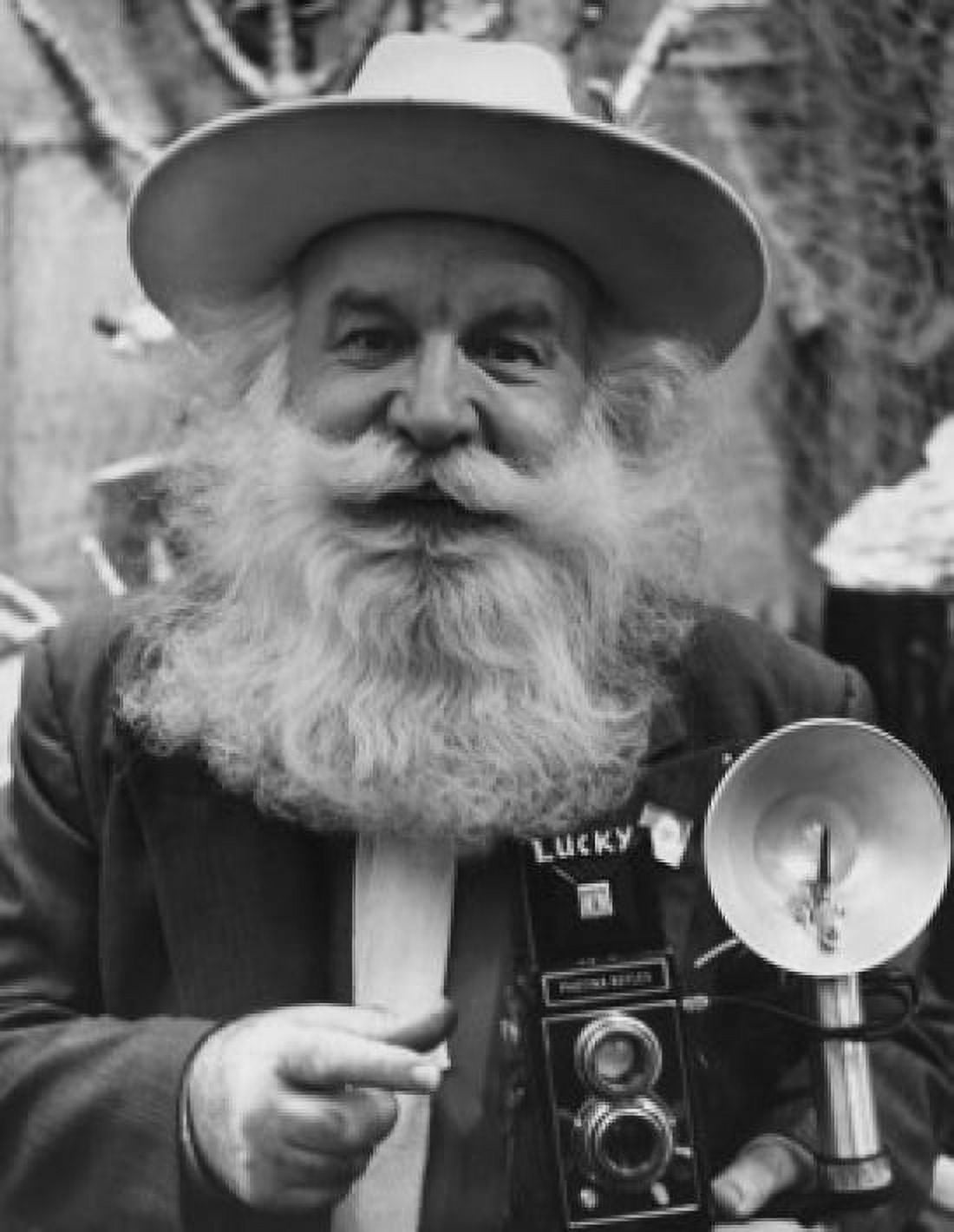 Portrait of a senior man holding a camera Canvas Art - (18 x 24)