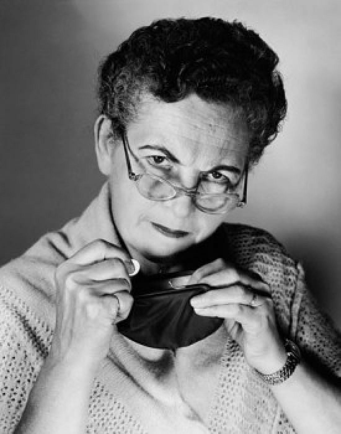 Portrait of a senior woman holding a coin Canvas Art - (18 x 24)