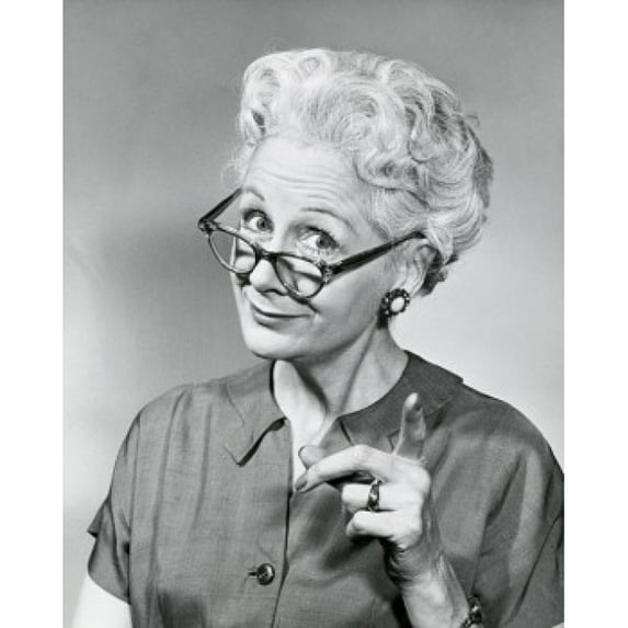 Portrait of a senior woman pointing forward Poster Print (24 x 36)
