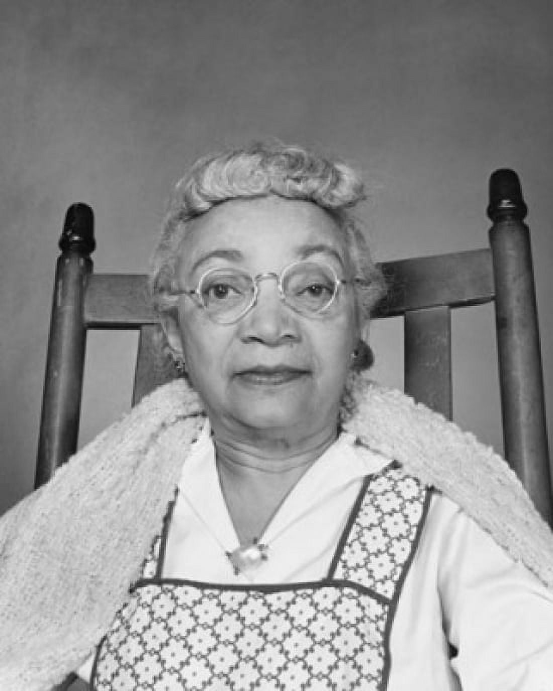 Portrait of a senior woman sitting in a chair Canvas Art - (24 x 36)