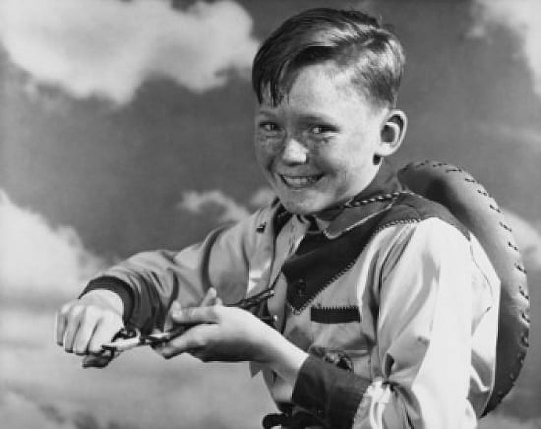 Portrait of a smiling boy whittling Canvas Art - (24 x 36)