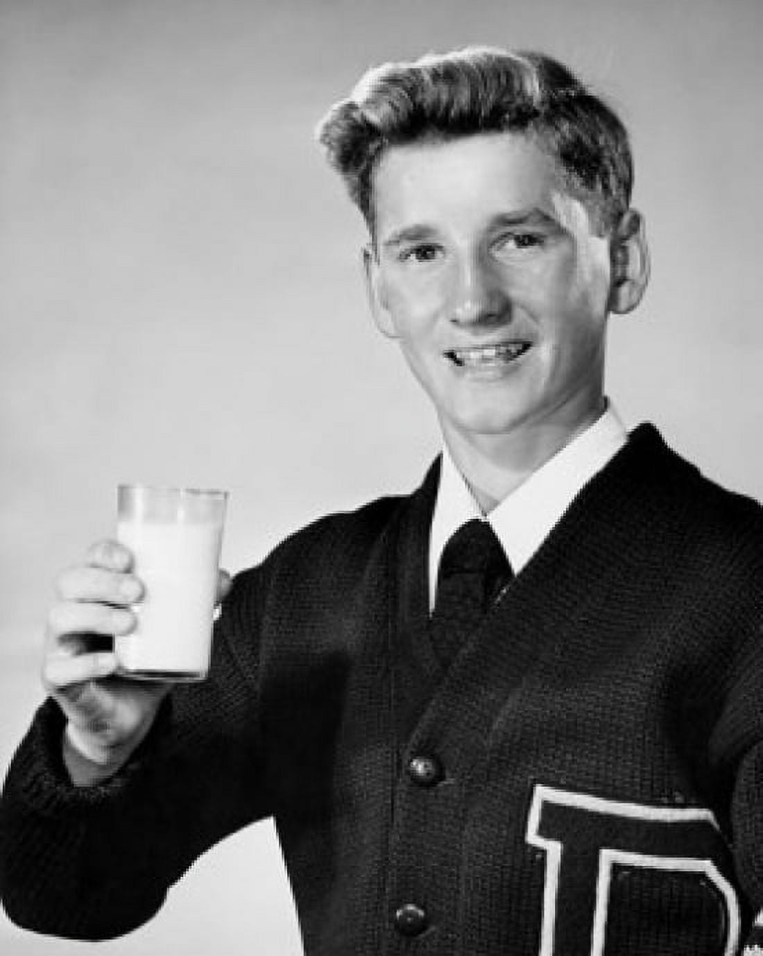 Portrait of a teenage boy holding a glass of milk Canvas Art - (24 x 36)