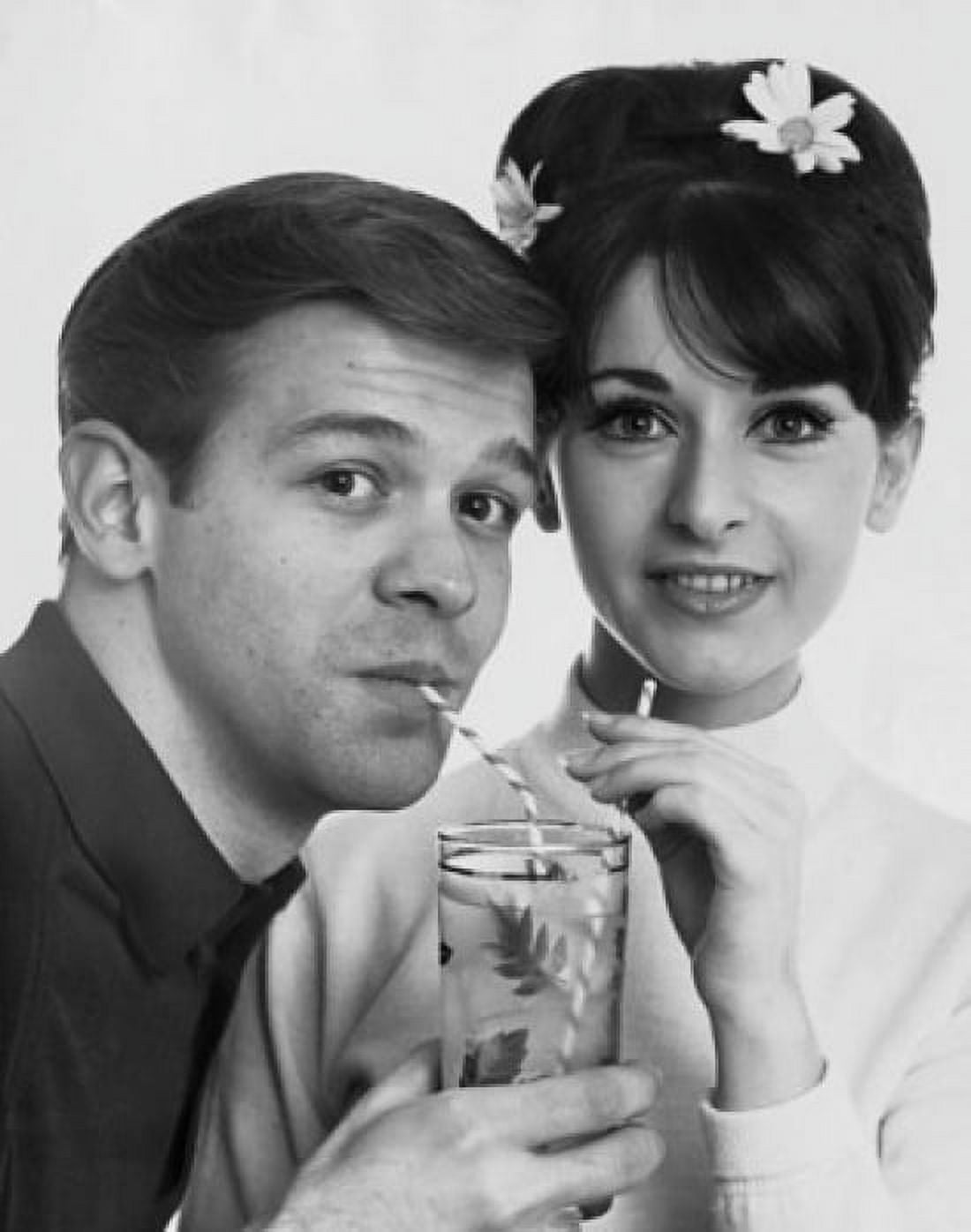 Portrait of a teenage couple sharing juice from a glass Canvas Art - (18 x 24)